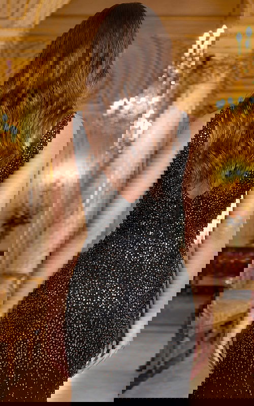 Back view of sleeveless beaded gown with V shaped back and smooth fit