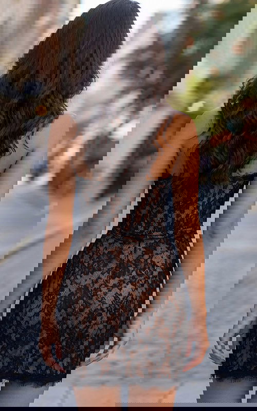 Fitted lace mini dress with structured bodice and wrap skirt