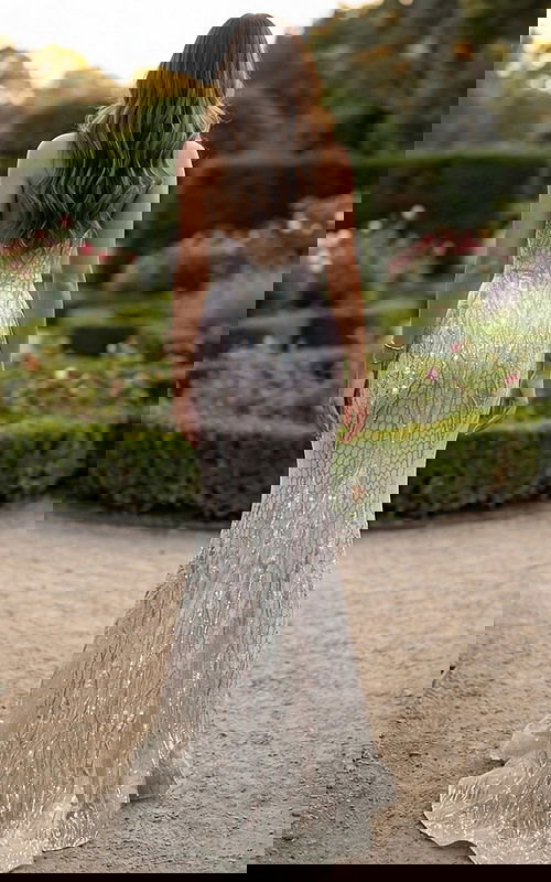 Back view of strapless mermaid gown with crystal beading and long sweep train