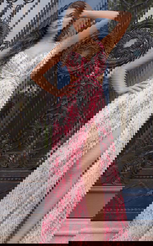 Floral pleated evening dress with wrap bodice, side cutouts, and thigh high slit