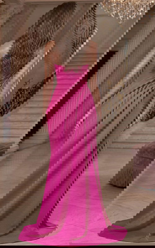 Back view of floor length satin gown with smooth flowing skirt