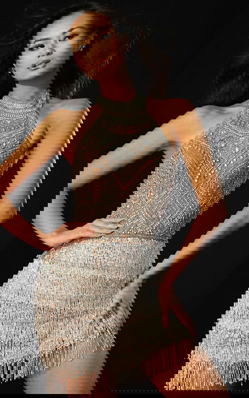 Shimmering short dress featuring detailed beadwork and fringe movement