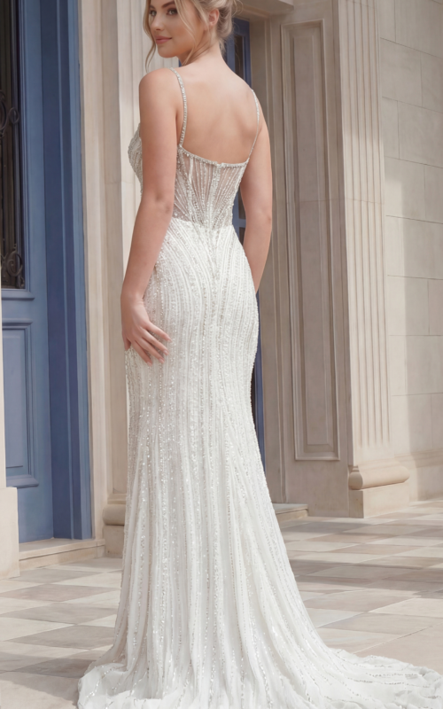 Back view of a fitted beaded gown with delicate straps and low back